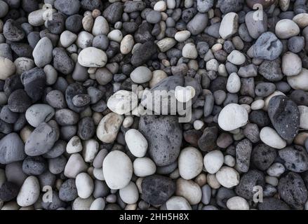 Gray and white pebbles at beach Stock Photo