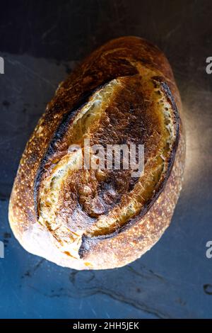 Freshly baked loaf of bread on table Stock Photo