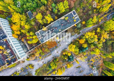 Ukraine, Kyiv Oblast, Pripyat, Aerial view of rooftops of abandoned city in autumn Stock Photo