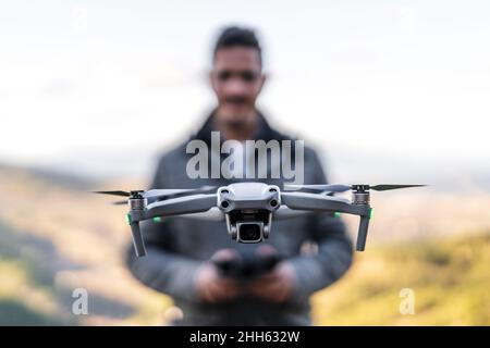 Man operating drone with controller Stock Photo