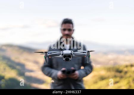 man with a controller standing in front of a PC console TV screen with a  steam controller playing popular free to play game Roblox Stock Photo -  Alamy