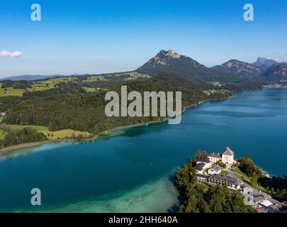 Austria, Salzburg, Hof bei Salzburg, Drone view of Lake Fuschl and Schloss Fuschl in summer Stock Photo