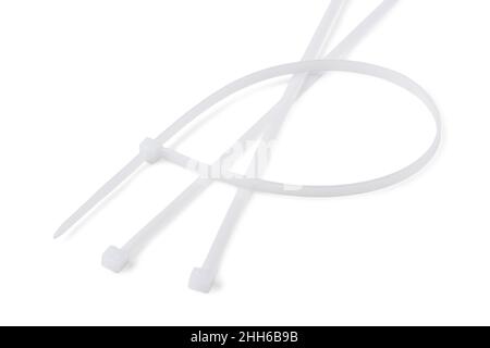 White plastic cable ties isolated on a white background Stock Photo