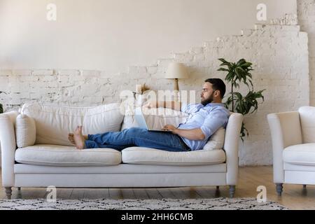 Focused millennial remote employee working from home Stock Photo