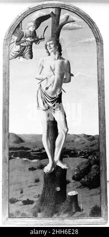 Saint Sebastian Francesco Botticini (Francesco di Giovanni) Italian The picture was purchased as a work of Andrea del Castagno. The treatment of the landscape, however, is uncharacteristic of Castagno's work, as is the feebly constructed figure. The closest affinities of style are with works by Francesco Botticini (about 1446–97), who seems to have been active in the workshop of Verrocchio in the late 1460s. Although the picture has been dated as early as 1465, it seems to depend from a famous altarpiece by Botticelli of 1473–74 in the Gemäldegalerie, Berlin-Dahlem. The picture has suffered co Stock Photo