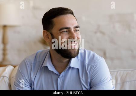 Headshot portrait millennial bearded guy in glasses staring at camera ...