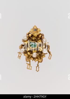 Cluster Brooch with Letters Spelling 'Amor' mid-15th century French This gold cluster jewel includes the Latin word amor (love) in delicate gold letters. It could have been worn either as a pendant or a brooch, and in portraits of young women many similar jewels are seen in their hair or at the shoulder or neck. Expensive jewelry played an important role in betrothal and marriage, and the groom gave brooches to the bride as tokens of love. In 1447, for example, Marco Parenti gave his betrothed, Caterina Strozzi, a golden brooch with two sapphires and three pearls to be worn on her shoulder.. C Stock Photo