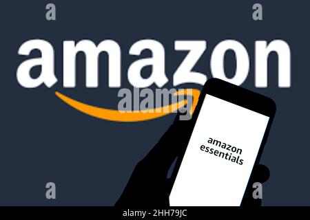 https://l450v.alamy.com/450v/2hh79jc/spain-12th-jan-2022-in-this-photo-illustration-amazon-essentials-logo-seen-displayed-on-a-smartphone-with-an-amazon-logo-in-the-background-credit-sopa-images-limitedalamy-live-news-2hh79jc.jpg
