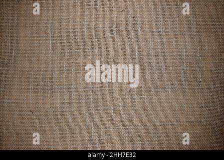 Abstract background. Burlap texture close-up. Rustic coarse linen fabric. Stock Photo