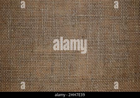 Abstract background. Burlap texture close up. Rustic coarse linen fabric. Stock Photo