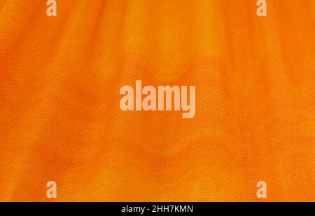 Texture, background, pattern. Orange Silk Fabric for Drapery Abstract Background. Abstract Fabric Flame Background, Artistic Waving Cloth Fractal Patt Stock Photo