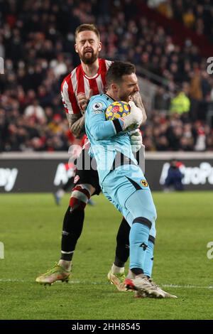 London, UK. 23rd Jan, 2022. Wolverhampton Wanderers Goalkeeper Jos S‡ runs into Ivan Toney of Brentford and is tackled by Pontus Jansson of Brentford during the Premier League match between Brentford and Wolverhampton Wanderers at Brentford Community Stadium, London, England on 22 January 2022. Photo by Ken Sparks. Editorial use only, license required for commercial use. No use in betting, games or a single club/league/player publications. Credit: UK Sports Pics Ltd/Alamy Live News Stock Photo