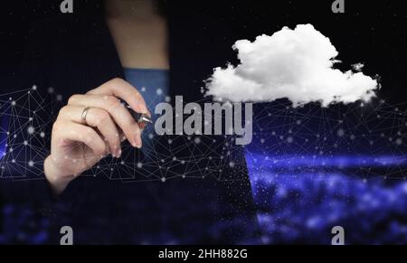 Abstract cloud technology digital. Communication network. Hand holding digital graphic pen and drawing digital hologram cloud sign on city dark blurre Stock Photo