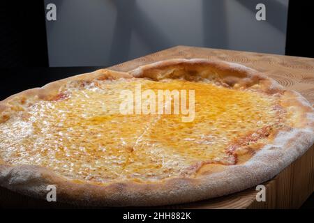 Helsinki / Finland - JANUARY 22, 2022: Closeup of homemade New York style Margherita cheese pizza. Stock Photo