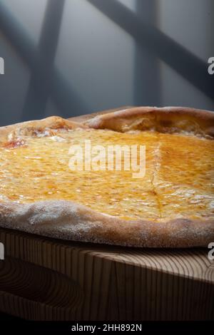 Helsinki / Finland - JANUARY 22, 2022: Closeup of homemade New York style Margherita cheese pizza. Stock Photo