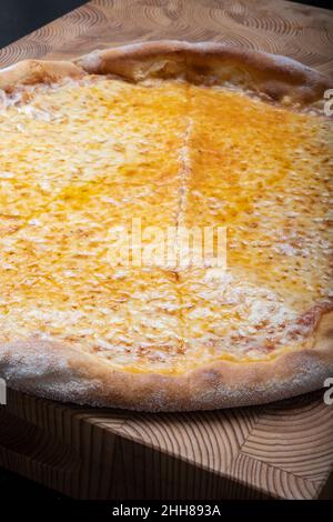 Helsinki / Finland - JANUARY 22, 2022: Closeup of homemade New York style Margherita cheese pizza. Stock Photo