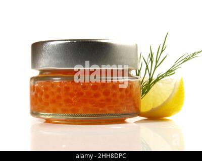 Trout Caviar in a Glass with Lemaon isolated on white Background Stock Photo