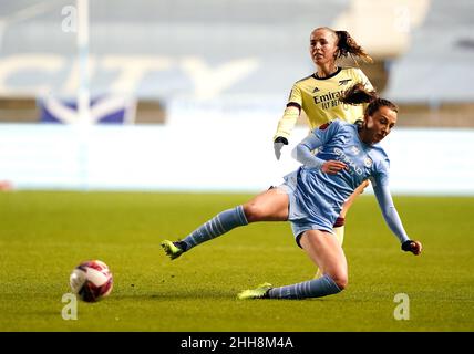 Manchester City's Caroline Weir (left) and Arsenal's Lia Walti battle for the ball during the Barclays FA Women's Super League match at Manchester City Academy Stadium, Manchester. Picture date: Sunday January 23, 2022. Stock Photo