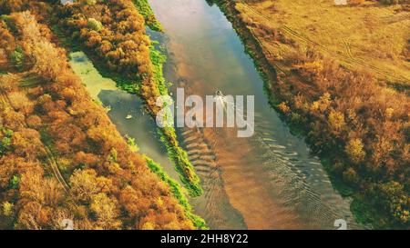 Aerial view of yellow boat floating at the sea Stock Photo - Alamy
