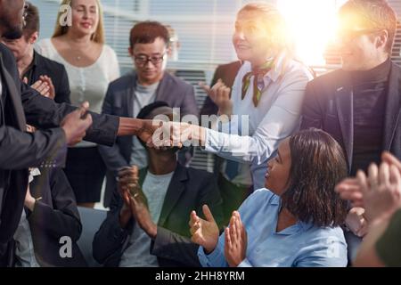 Image employers in office shaking hands after successful negotiations or interview Stock Photo