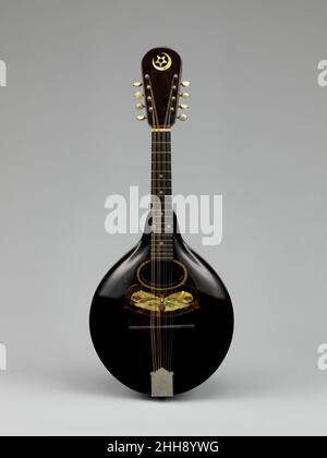 This 19th-century mandolin is a stringed musical instrument reflecting ...