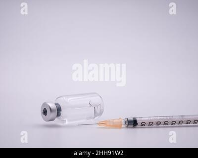 Bottle of medicine and syringe isolated on white background Stock Photo