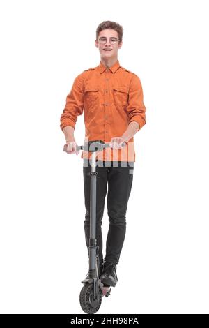 Pleasant smiling man riding a kick scooter Stock Photo