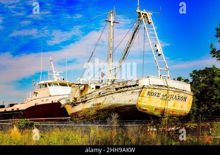 An old wooden shrimp boat is in dry dock for repair at a local shipyard, May 15, 2016, in Bayou La Batre, Alabama. Stock Photo