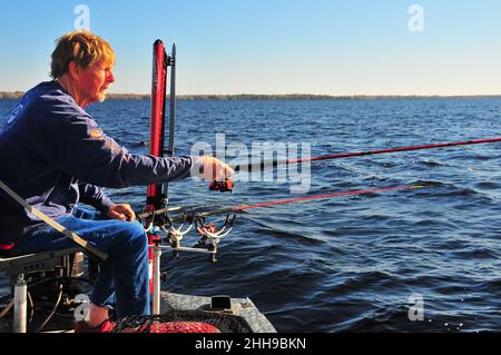 Guide Jack Smith fishes for crappie (speckled perch) from Central Florida waters..Electronics and PowerPoles are vital to successful crappie fishing. Stock Photo