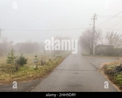 Mist in the country early winter, trees covered with frost Stock Photo