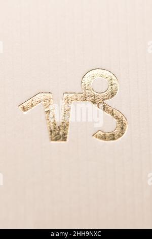 Close up horoscope sign of the zodiac symbol in gold leaf representing the constellation of Capricorn Stock Photo