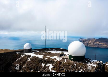 Other-worldly white globes on the rugged rock are the remnants of a Cold War military base. Stock Photo