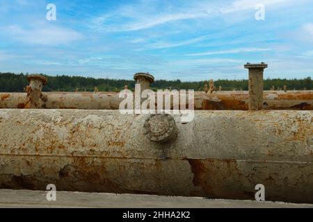 Broken, rusty production pipes for cooling water Stock Photo