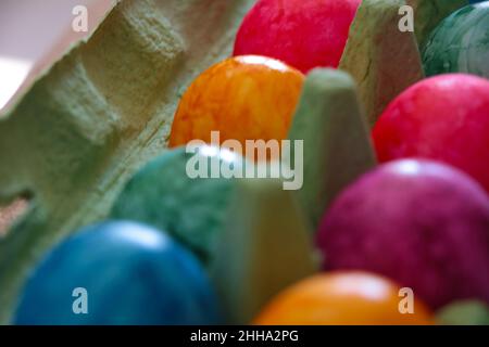 There are Easter eggs in a cardboard box. Holiday symbol. Out of focus Stock Photo