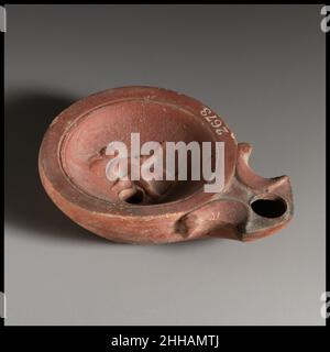 Terracotta oil lamp 1st century B.C.–1st century A.D. Roman. Terracotta oil lamp  241585 Stock Photo