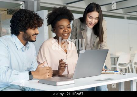 Student diverse people group working or learning together using laptop Stock Photo