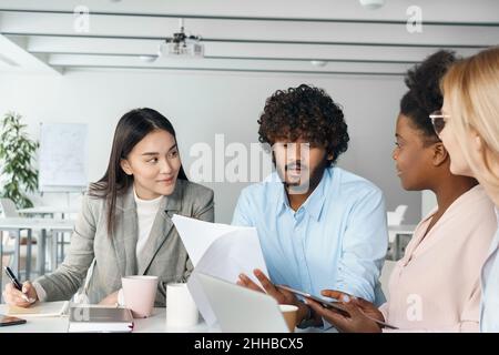 Diverse startup team business people executives group working together in office Stock Photo