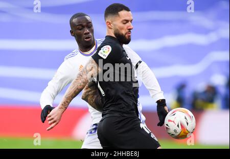 Madrid, Spain. 23rd Jan, 2022. Real Madrid's Ferland Mendy (back) vies with Elche's Tete Morente during a Spanish first division league football match between Real Madrid and Elche CF in Madrid, Spain, Jan. 23, 2022. Credit: Gustavo Valiente/Xinhua/Alamy Live News Stock Photo
