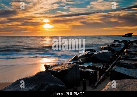 Sunset Over SS Atlantus Shipwreck and Ferry in Background, Cape May, New Jersey Stock Photo