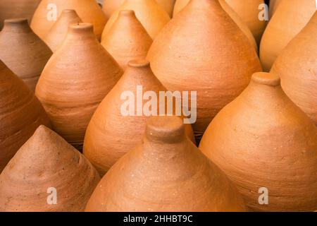 Many clay pots in the pottery workshop close-up Stock Photo