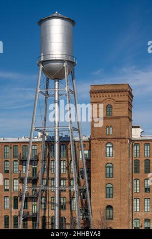 Vintage water tower at the Eagle & Phenix, a restored 19th century cotton mill on the RiverWalk along the Chattahoochee River in Uptown Columbus, GA. Stock Photo