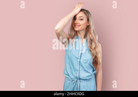 Now thats epic. Studio shot of a young woman with air being blown in her  face against a blue background Stock Photo - Alamy