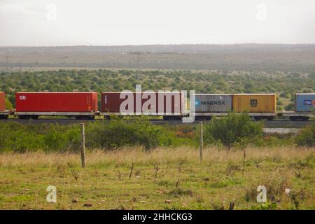 Cargo train on the Nairobi Mombasa Railway seen from Nairobi National Park, Kenya Stock Photo