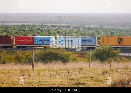 Cargo train on the Nairobi Mombasa Railway seen from Nairobi National Park, Kenya Stock Photo