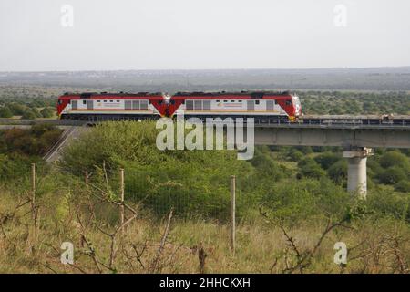 Cargo train on the Nairobi Mombasa Railway seen from Nairobi National Park, Kenya Stock Photo