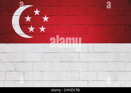 The flag of Singapore painted on a brick wall. Stock Photo