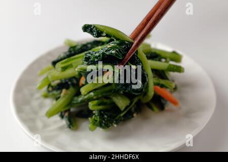 Young radish water kimchi on white background Stock Photo