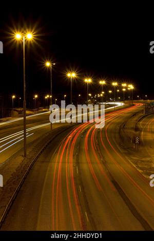 Head and tail-lights on motorway. Stock Photo