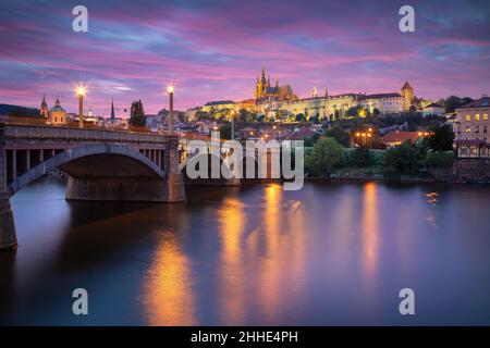Prague, Czech Republic. Cityscape image of Prague, capital city of Czech Republic with St. Vitus Cathedral and the Charles Bridge over Vltava River at Stock Photo