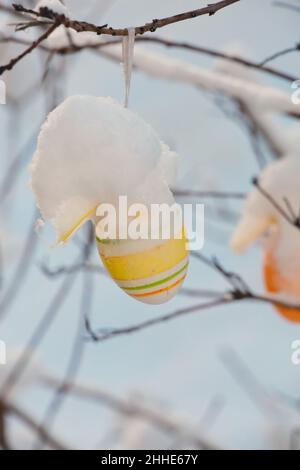 beautiful easter eggs on a tree branch outdoors Stock Photo